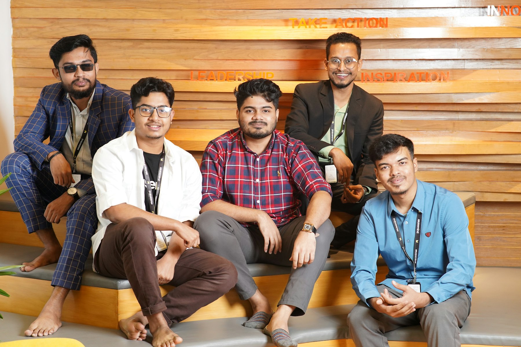An Indian team gathered together in their office